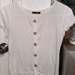 It’s a brand new crop top with bottons